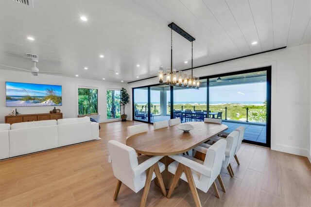 dining space with a healthy amount of sunlight and light wood-type flooring