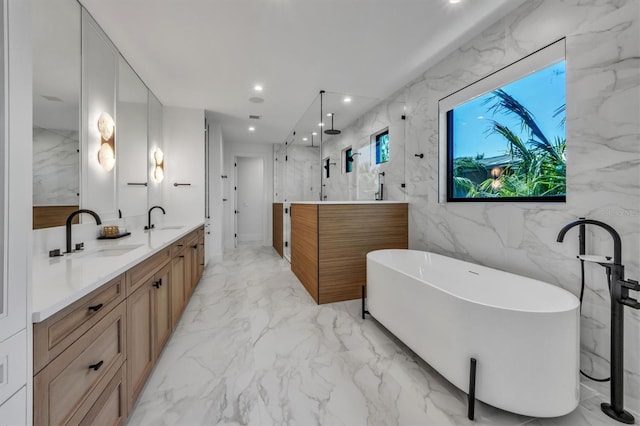 bathroom with vanity, shower with separate bathtub, tile patterned flooring, and tile walls