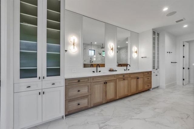 bathroom featuring vanity and a shower