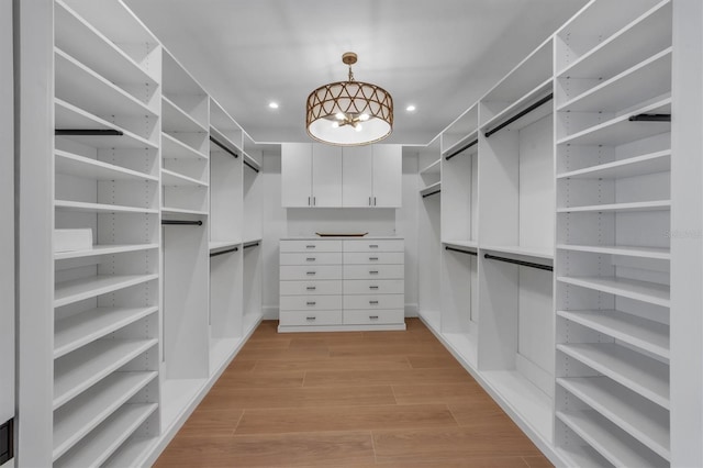 walk in closet featuring light wood-type flooring
