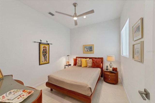 tiled bedroom with ceiling fan