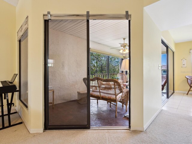 hallway with vaulted ceiling and carpet