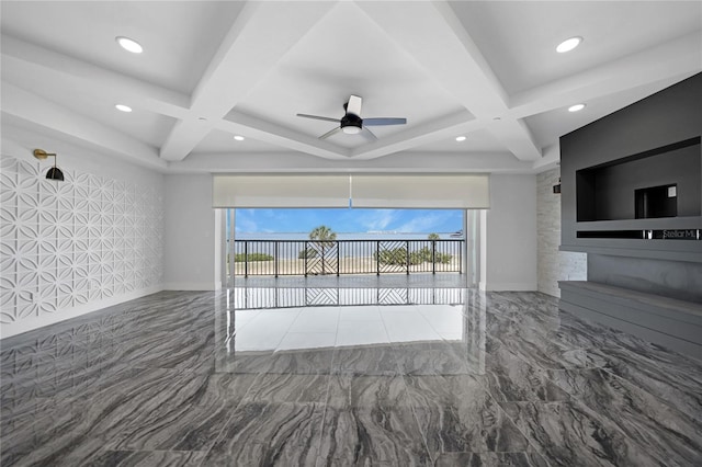 interior space with coffered ceiling, dark tile flooring, and ceiling fan