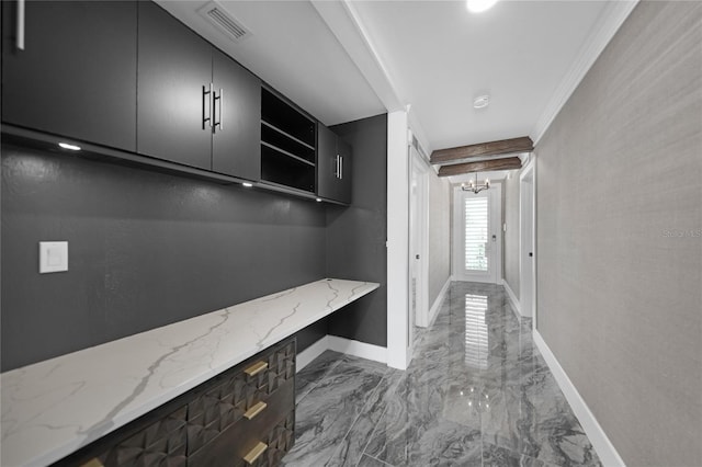 mudroom with beamed ceiling, light tile floors, and ornamental molding