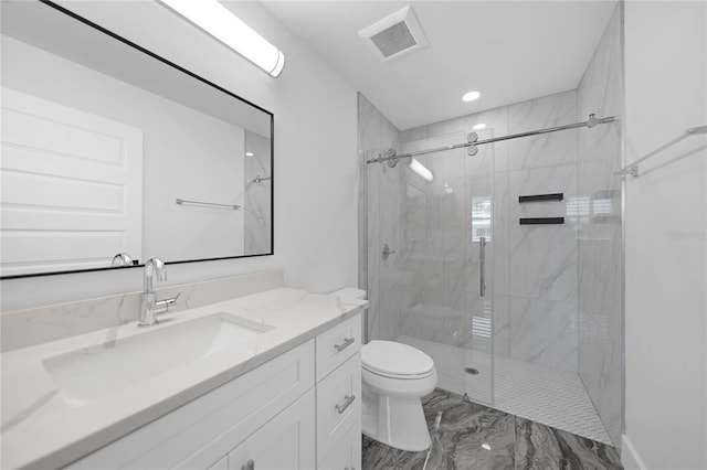 bathroom featuring a shower with door, toilet, oversized vanity, and tile flooring