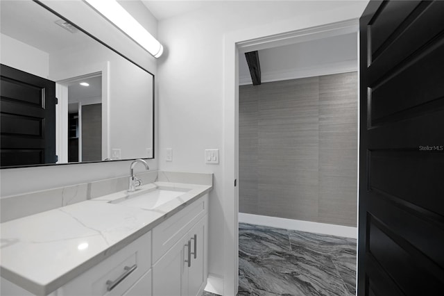 bathroom with tile flooring and vanity