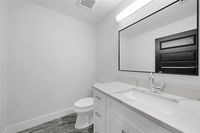 bathroom featuring toilet, tile flooring, and large vanity