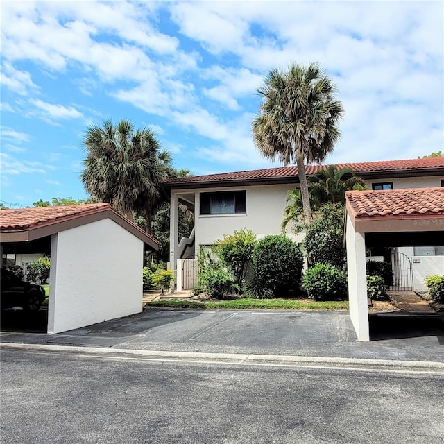 view of side of home featuring a carport