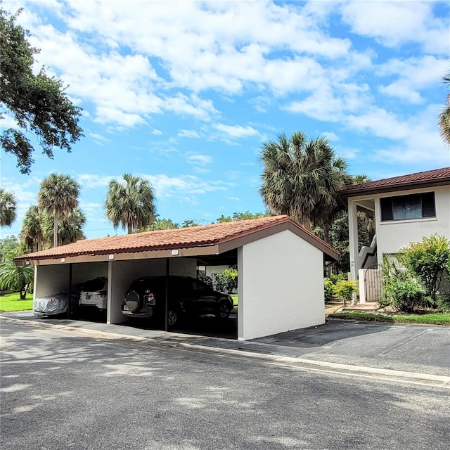 exterior space featuring a carport