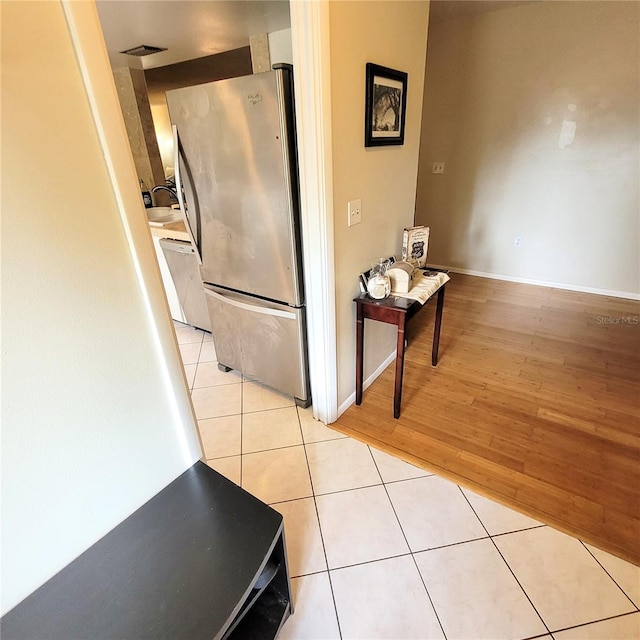 hallway with light tile floors