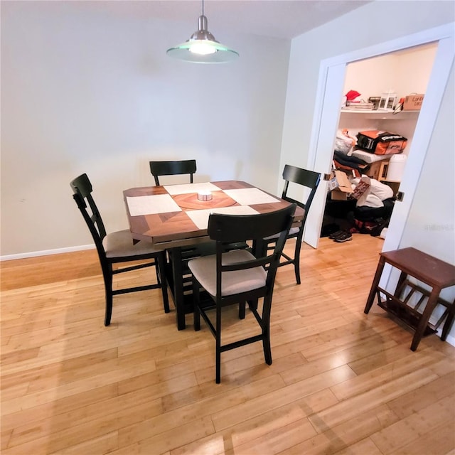 dining space with light hardwood / wood-style floors