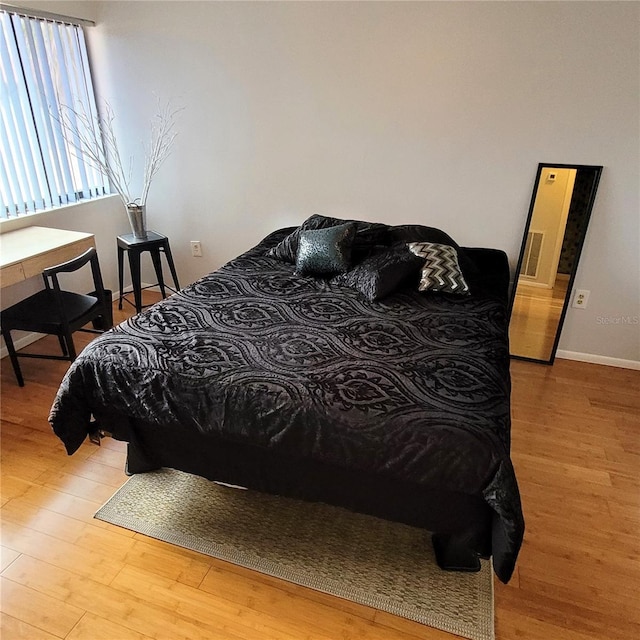 bedroom with light hardwood / wood-style floors