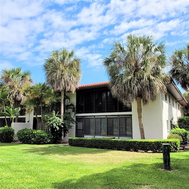 rear view of house with a lawn