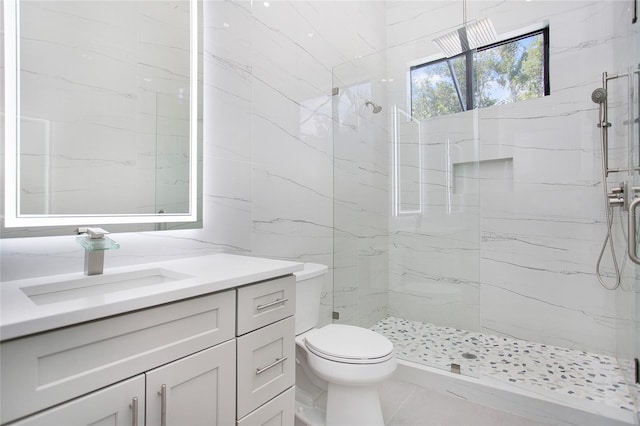 4111 Williams Rd, Estero, FL 33928 - full bath featuring toilet, a marble finish shower, vanity, and tile walls