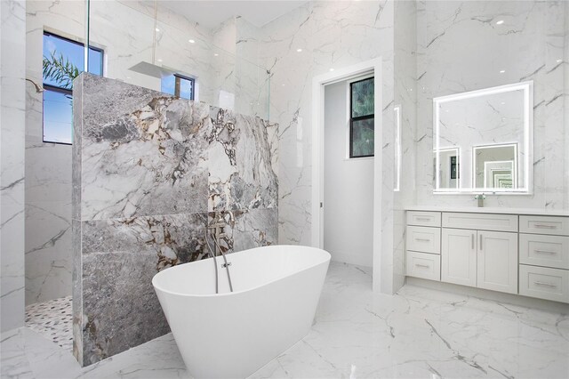 4111 Williams Rd, Estero, FL 33928 - full bath with stone wall, a marble finish shower, and a soaking tub