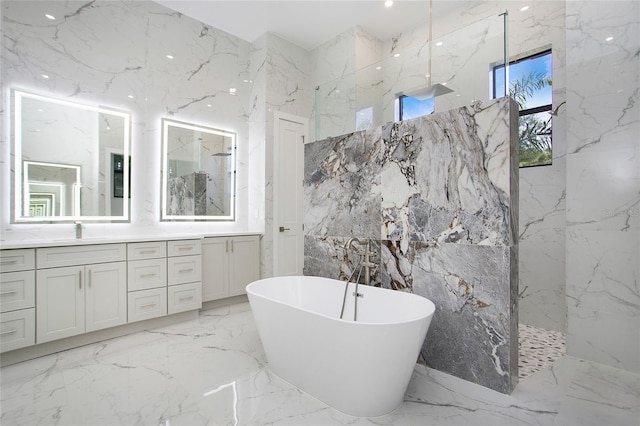 4111 Williams Rd, Estero, FL 33928 - full bathroom with stone wall, a soaking tub, a marble finish shower, and vanity