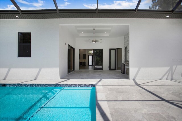 4111 Williams Rd, Estero, FL 33928 - outdoor pool featuring a patio, glass enclosure, and a ceiling fan