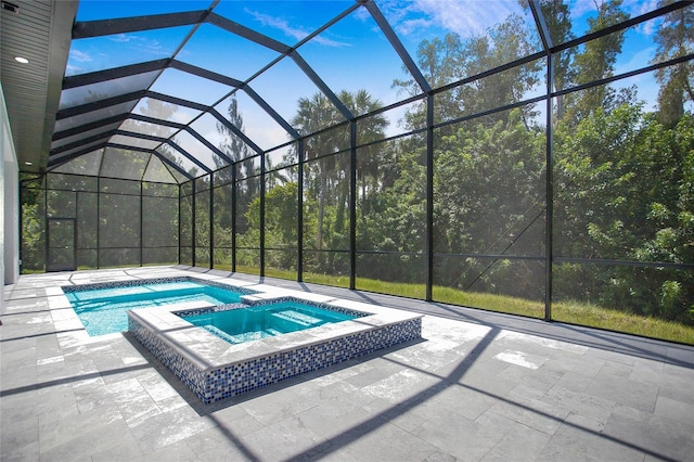 4111 Williams Rd, Estero, FL 33928 - view of pool with a lanai, a pool with connected hot tub, and a patio