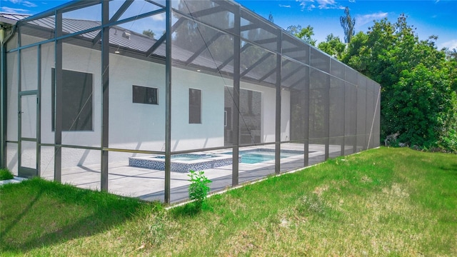 4111 Williams Rd, Estero, FL 33928 - view of side of property featuring a yard, a patio area, metal roof, a lanai, and an outdoor pool