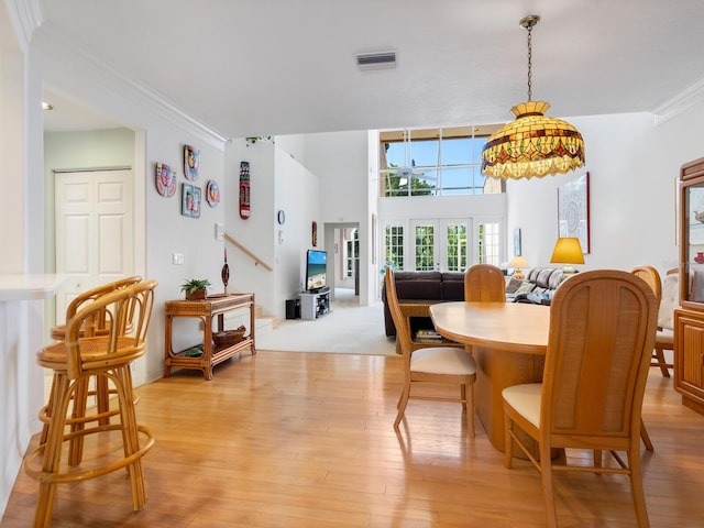 carpeted dining room featuring french doors