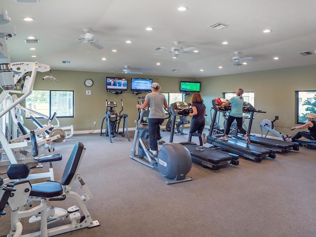 gym featuring light colored carpet and ceiling fan