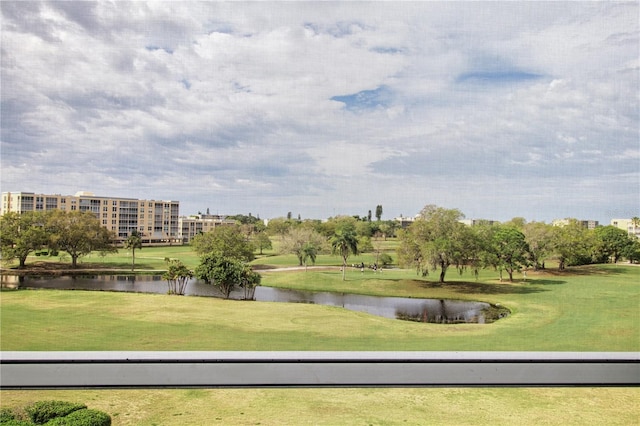 view of community featuring a yard and a water view