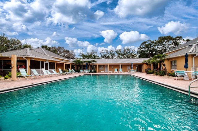 view of swimming pool featuring a patio area