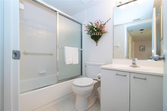 full bathroom with toilet, enclosed tub / shower combo, tile patterned floors, and vanity