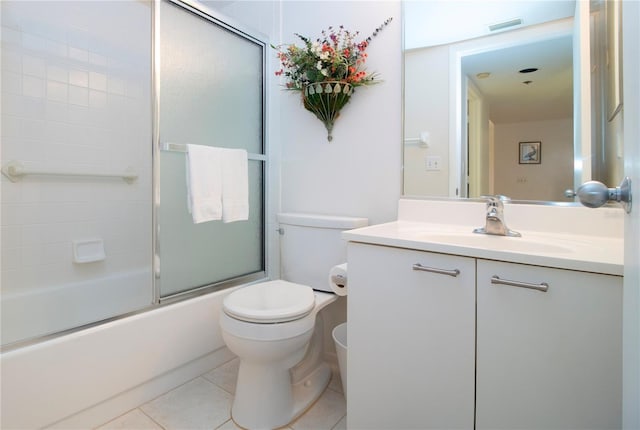 full bathroom with toilet, vanity, tile patterned floors, and combined bath / shower with glass door