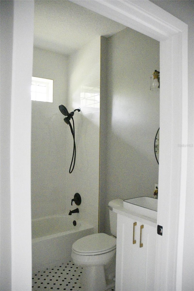 full bathroom with vanity, toilet, and washtub / shower combination