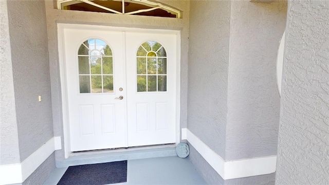 property entrance featuring french doors