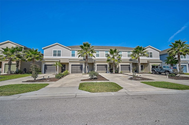 multi unit property featuring a garage