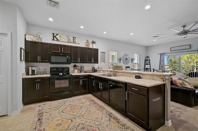 kitchen featuring kitchen peninsula, sink, ceiling fan, black appliances, and dark brown cabinetry