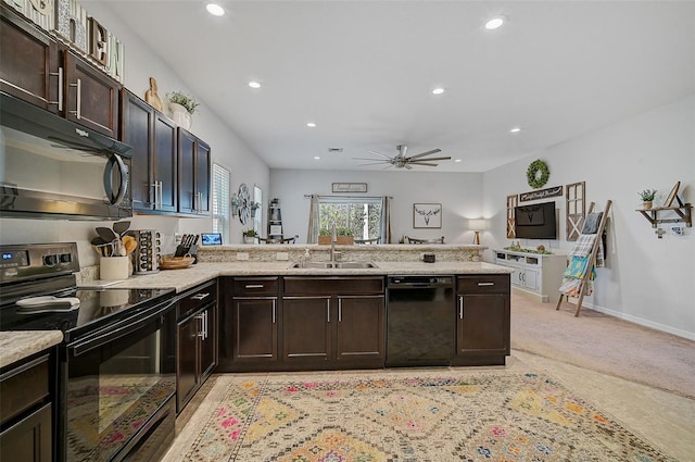 kitchen featuring dark brown cabinetry, ceiling fan, sink, black appliances, and kitchen peninsula