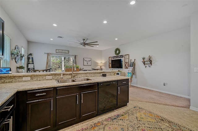 kitchen featuring dark brown cabinetry, ceiling fan, sink, light colored carpet, and black dishwasher