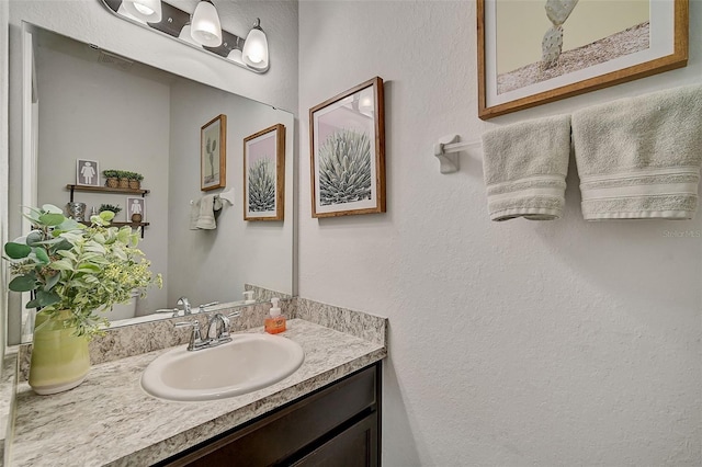 bathroom featuring vanity with extensive cabinet space