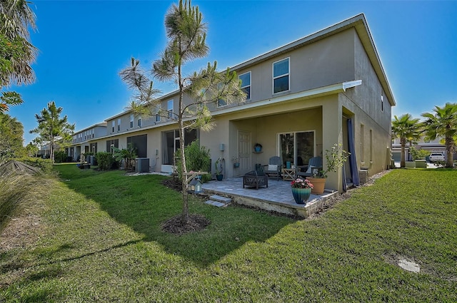 back of house with a patio area, a yard, and central air condition unit