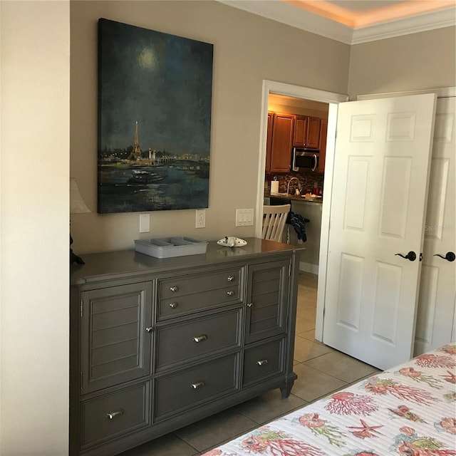 bedroom featuring ornamental molding and light tile floors