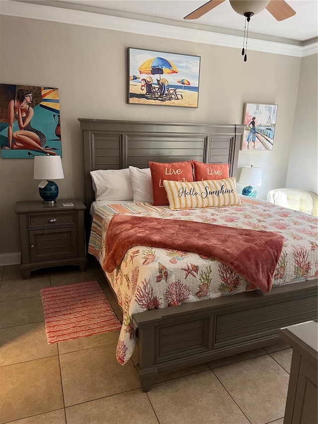 tiled bedroom with ceiling fan and crown molding