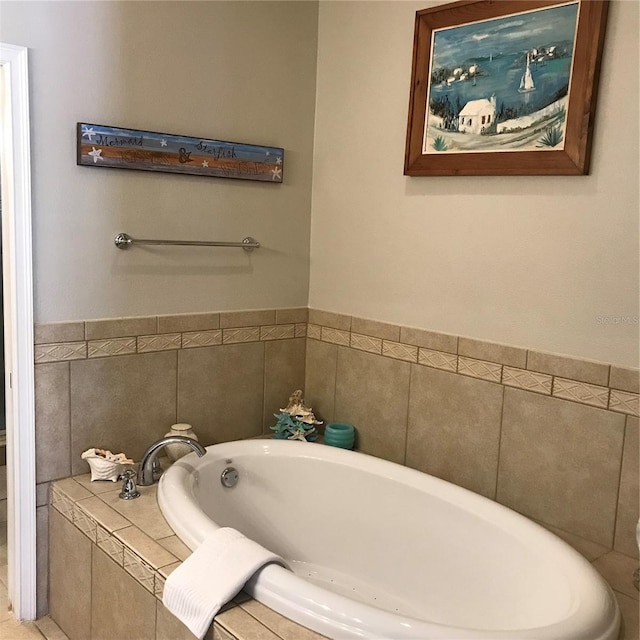 bathroom with a relaxing tiled bath