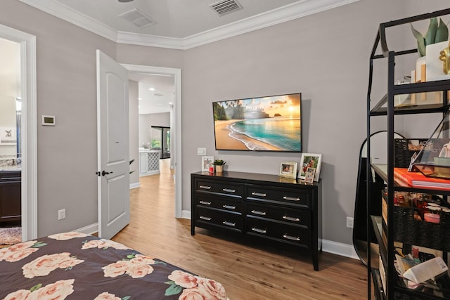 bedroom with light hardwood / wood-style floors and crown molding