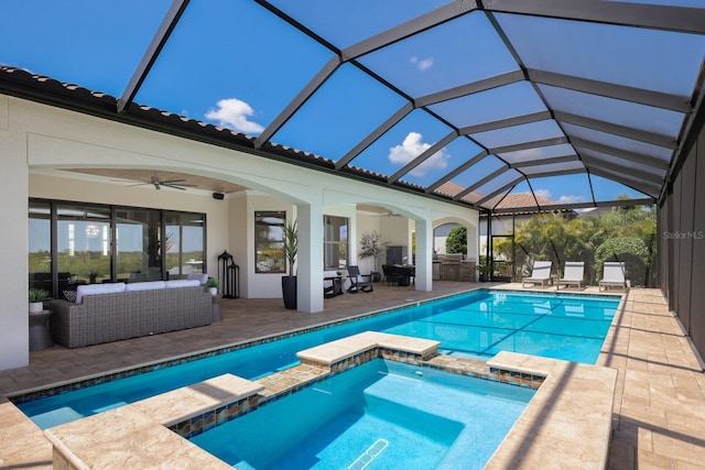 view of swimming pool with an in ground hot tub, outdoor lounge area, a patio area, ceiling fan, and a lanai