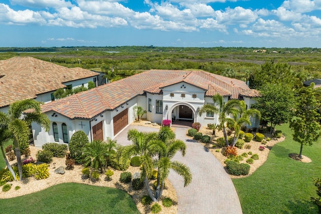 view of front of house featuring a garage and a front yard