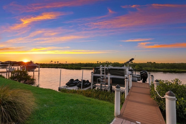 dock area featuring a yard and a water view