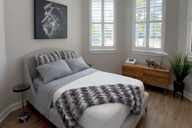 bedroom featuring hardwood / wood-style floors