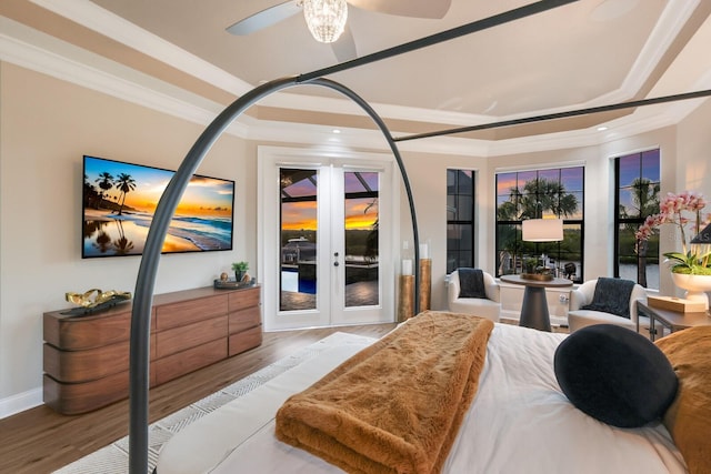 bedroom featuring ornamental molding, french doors, light hardwood / wood-style flooring, and access to outside