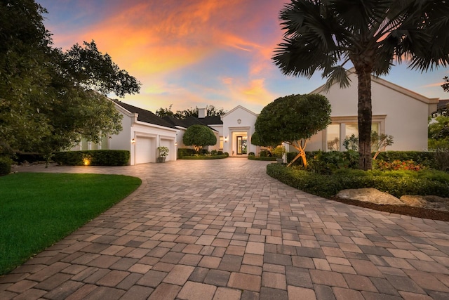 mediterranean / spanish-style house with a garage