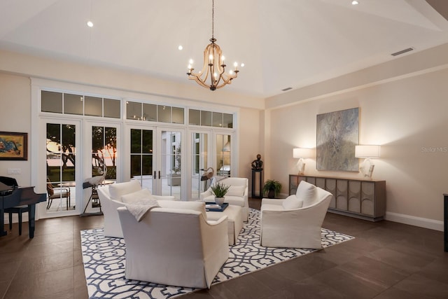 living room with an inviting chandelier and french doors