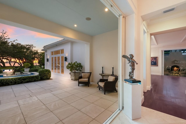 patio terrace at dusk featuring french doors