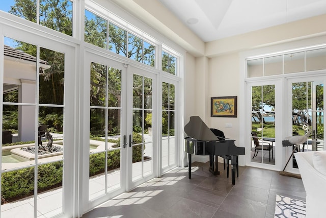 misc room featuring french doors and plenty of natural light